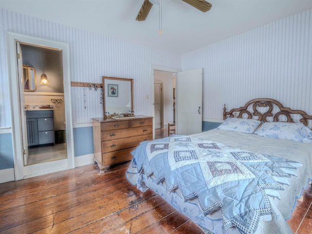 bedroom featuring ensuite bathroom, ceiling fan, and dark hardwood / wood-style floors