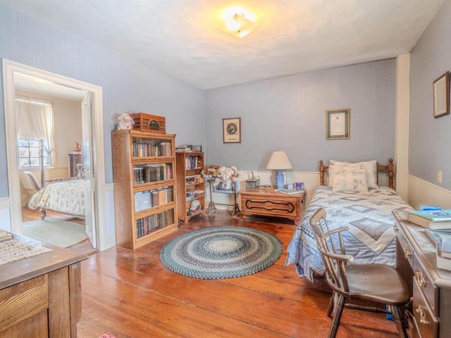 bedroom with hardwood / wood-style floors