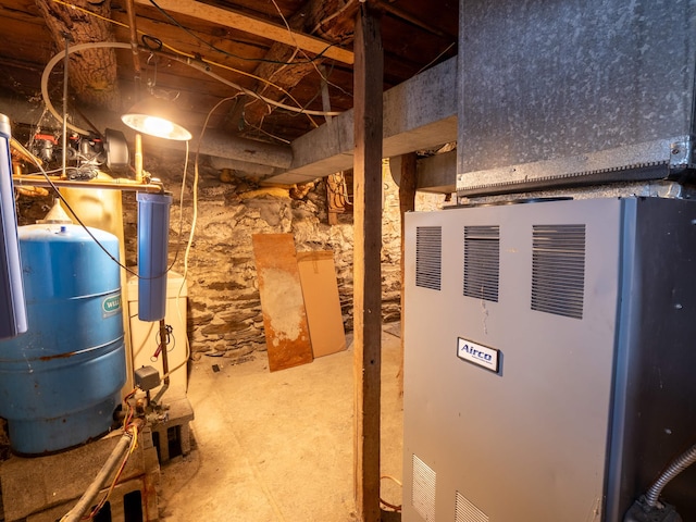 utility room with heating unit