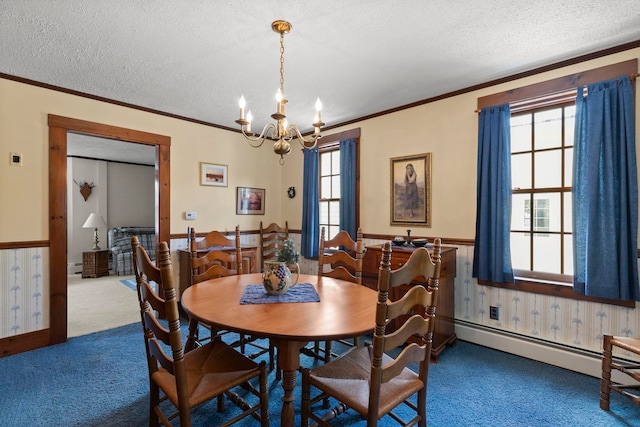 dining space with a baseboard radiator, a notable chandelier, ornamental molding, a textured ceiling, and carpet flooring