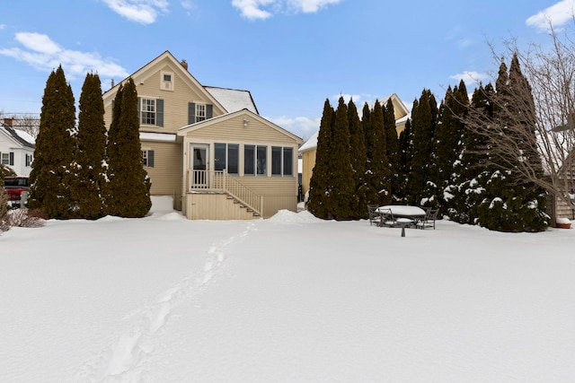 view of snow covered house