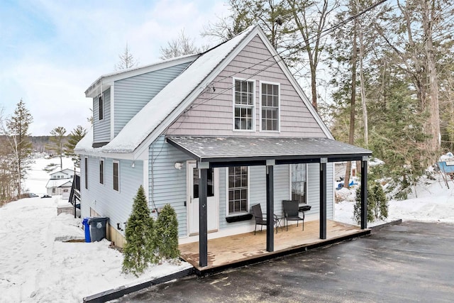 view of snow covered house