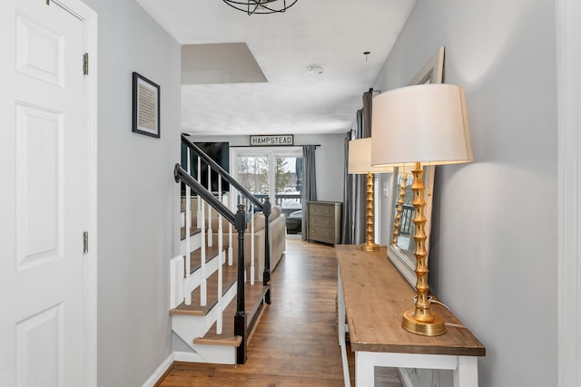 corridor with dark hardwood / wood-style flooring