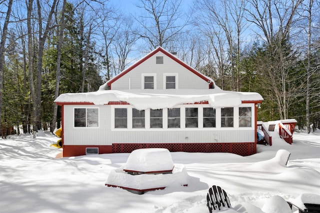 view of snow covered house