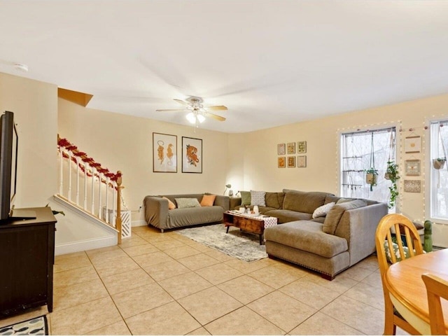 tiled living room featuring ceiling fan