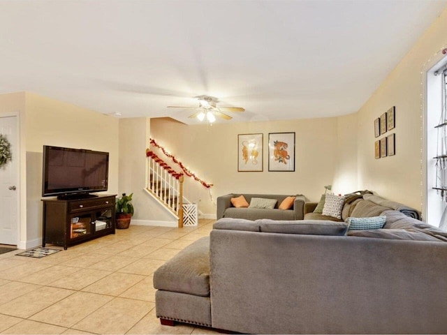 tiled living room with ceiling fan