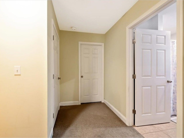 corridor with light tile patterned floors