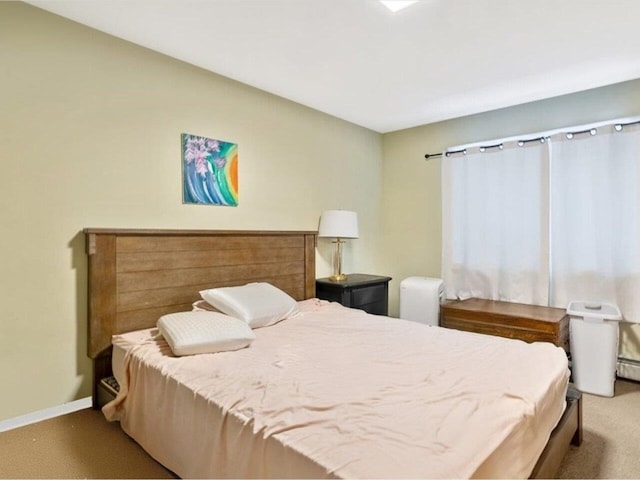 bedroom with light colored carpet