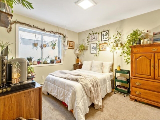 bedroom with light colored carpet