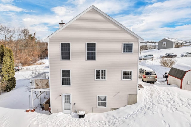 view of snow covered exterior with central air condition unit