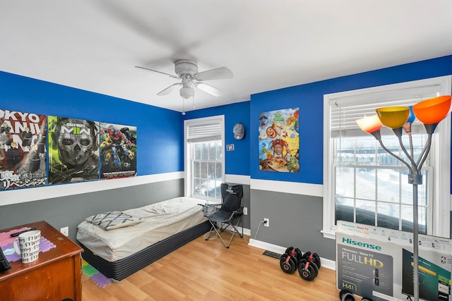 bedroom with hardwood / wood-style flooring and ceiling fan