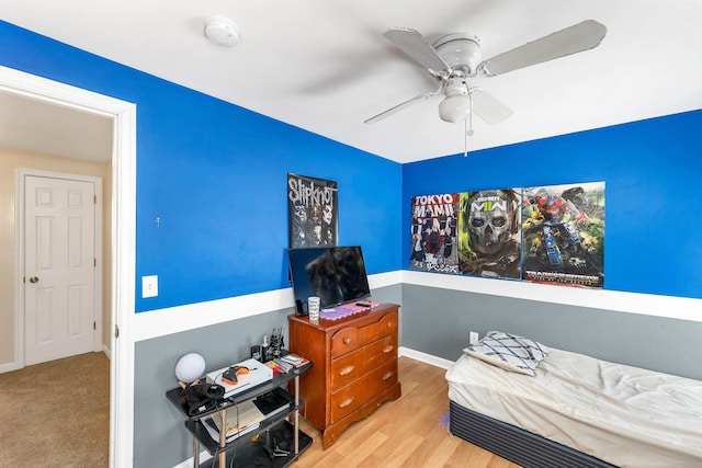 bedroom with ceiling fan and light hardwood / wood-style flooring