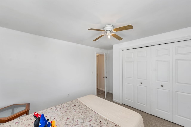 unfurnished bedroom featuring carpet floors, a closet, and ceiling fan