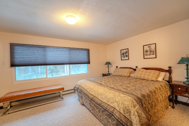 bedroom with multiple windows, carpet floors, and baseboard heating