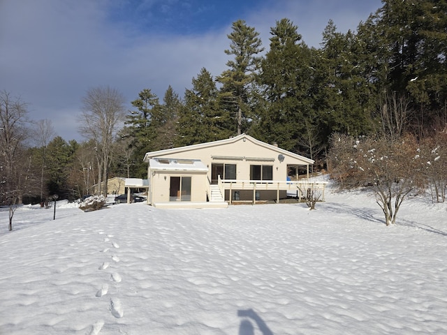 view of front of property with a wooden deck