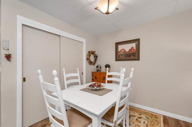 dining area with wood-type flooring