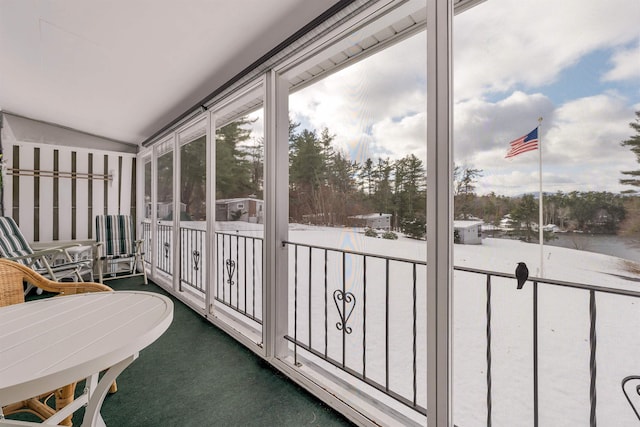 sunroom featuring lofted ceiling