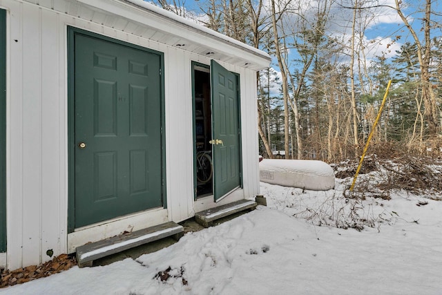 view of snow covered property entrance