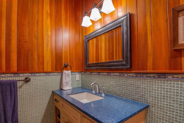 bathroom featuring tile walls and vanity