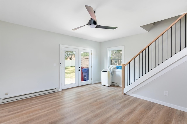 entrance foyer with ceiling fan, light wood-type flooring, french doors, and a baseboard heating unit