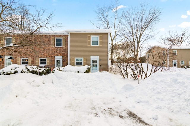 view of snow covered house