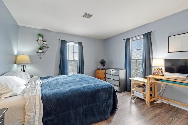 bedroom with wood-type flooring