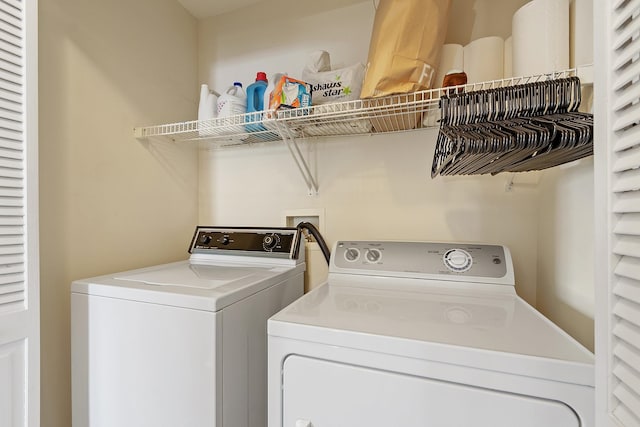 washroom with washer and dryer