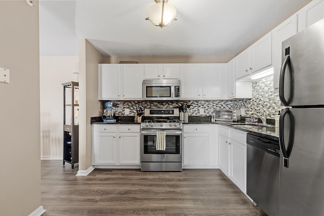 kitchen with sink, stainless steel appliances, and white cabinets