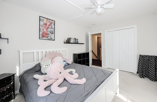 carpeted bedroom with a closet and ceiling fan