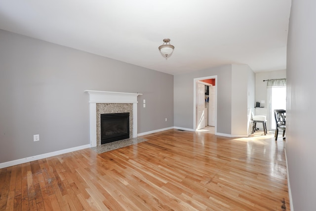 unfurnished living room with light wood-type flooring