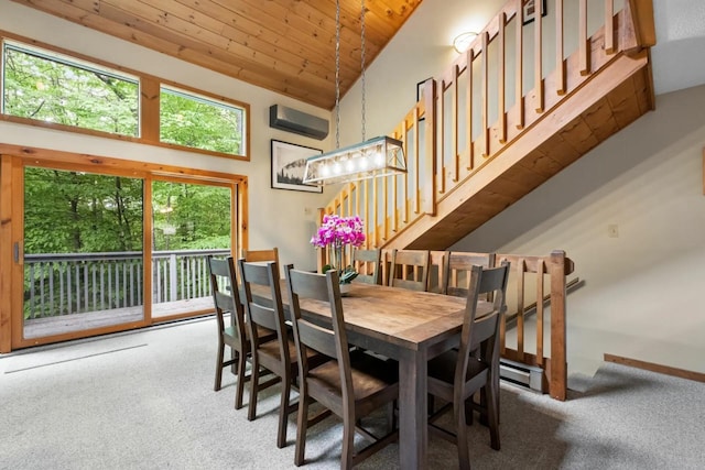 carpeted dining space featuring an AC wall unit, high vaulted ceiling, and wooden ceiling