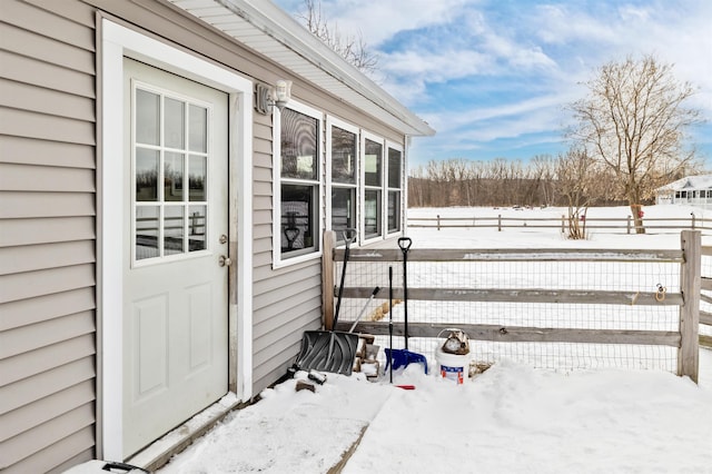 view of snow covered property entrance