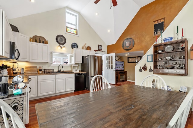 kitchen with white cabinetry, sink, black appliances, and plenty of natural light