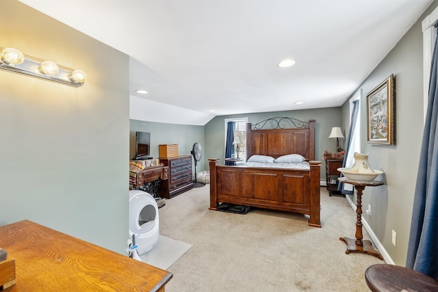 carpeted bedroom with multiple windows and lofted ceiling