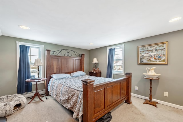 carpeted bedroom with baseboard heating