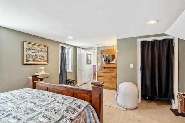 bedroom featuring light colored carpet