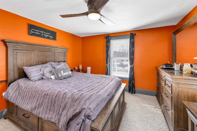 bedroom with light carpet and ceiling fan