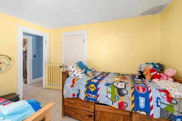 carpeted bedroom featuring radiator heating unit