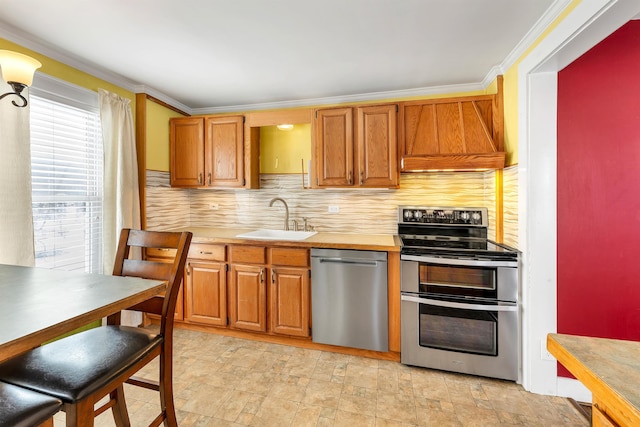 kitchen featuring sink, custom range hood, stainless steel appliances, ornamental molding, and tasteful backsplash