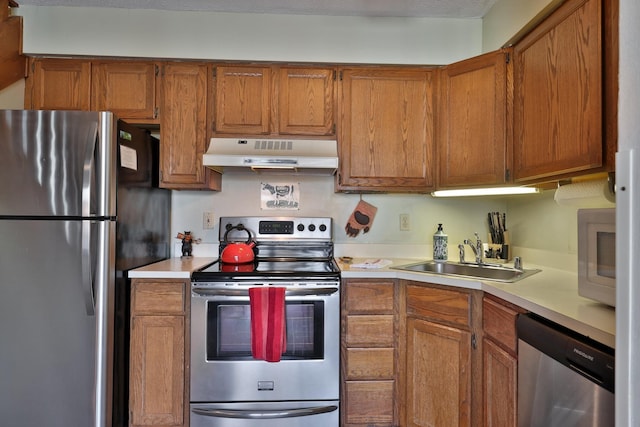 kitchen with sink and appliances with stainless steel finishes