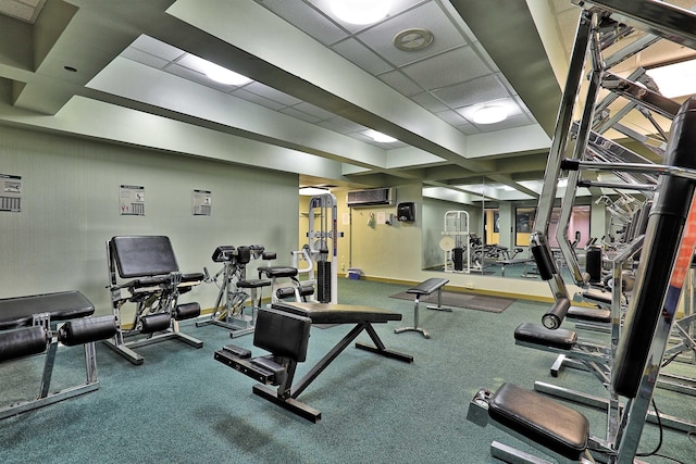 workout area featuring a paneled ceiling