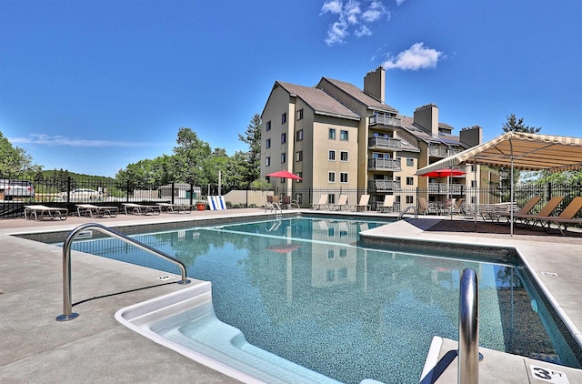 view of swimming pool with a patio