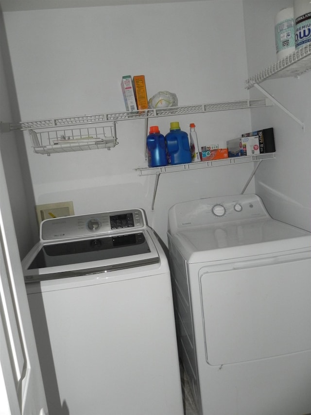 washroom featuring washing machine and dryer