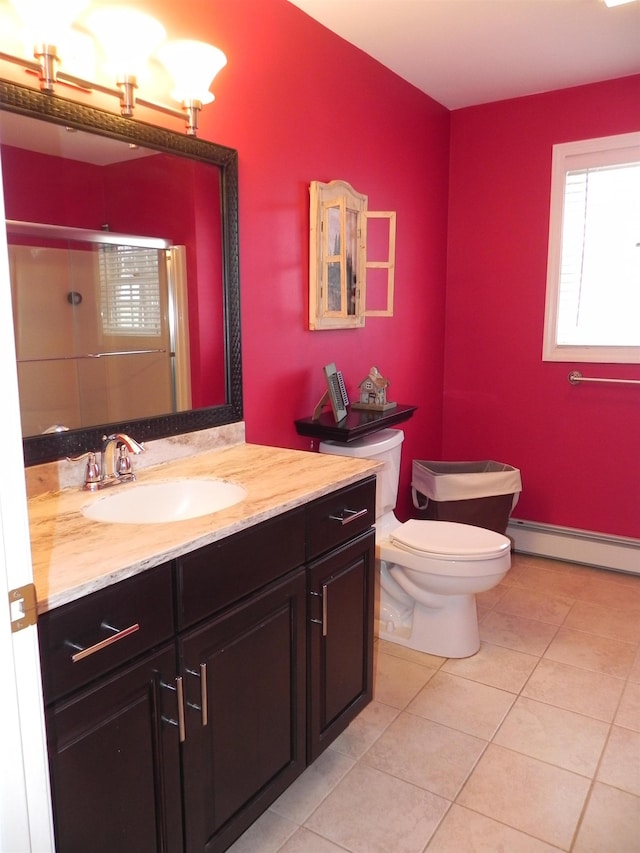 bathroom featuring toilet, an enclosed shower, tile patterned floors, vanity, and a baseboard heating unit