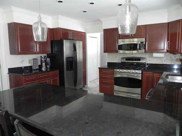 kitchen with backsplash, appliances with stainless steel finishes, crown molding, and hanging light fixtures