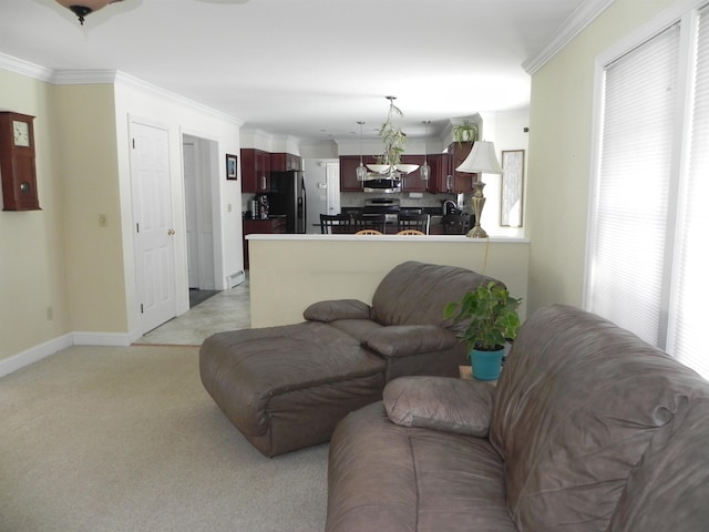 living room with ornamental molding and light colored carpet