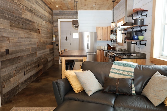 living room with wooden walls and wooden ceiling