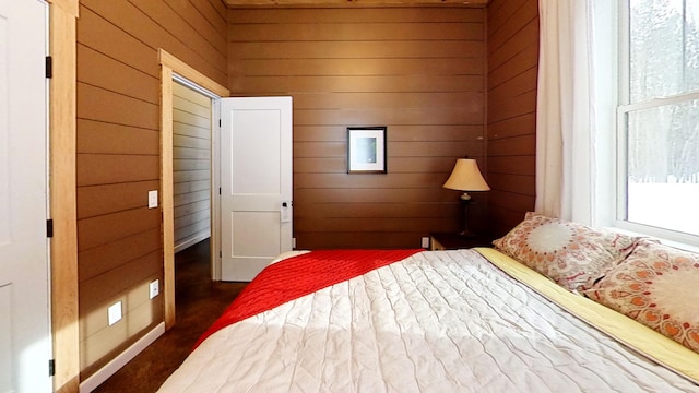 unfurnished bedroom with wood walls