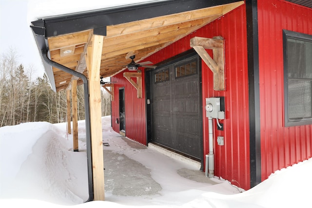 view of snow covered property entrance