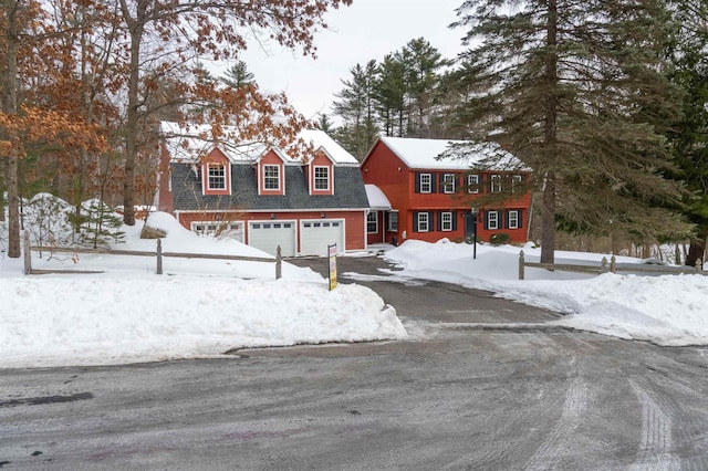 view of front of property with driveway and an attached garage